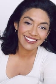 June Christopher as Anchorwoman in Misery 1990